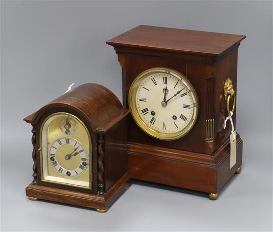 A mahogany-cased mantel clock with brass lion mask and ring handles and a small oak-cased mantel clock